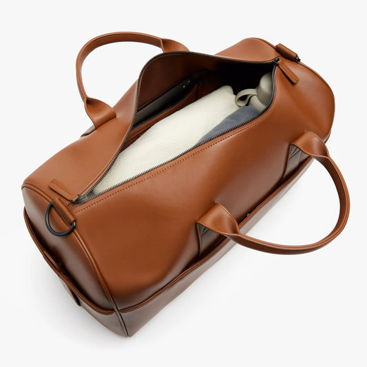 Waterproof Scratch-Resistant Faux Leather Travel Duffle Bag with 16-inch Laptop Sleeve & Luggage Sleeve